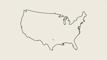 An outline map of the United States with one amber dot
